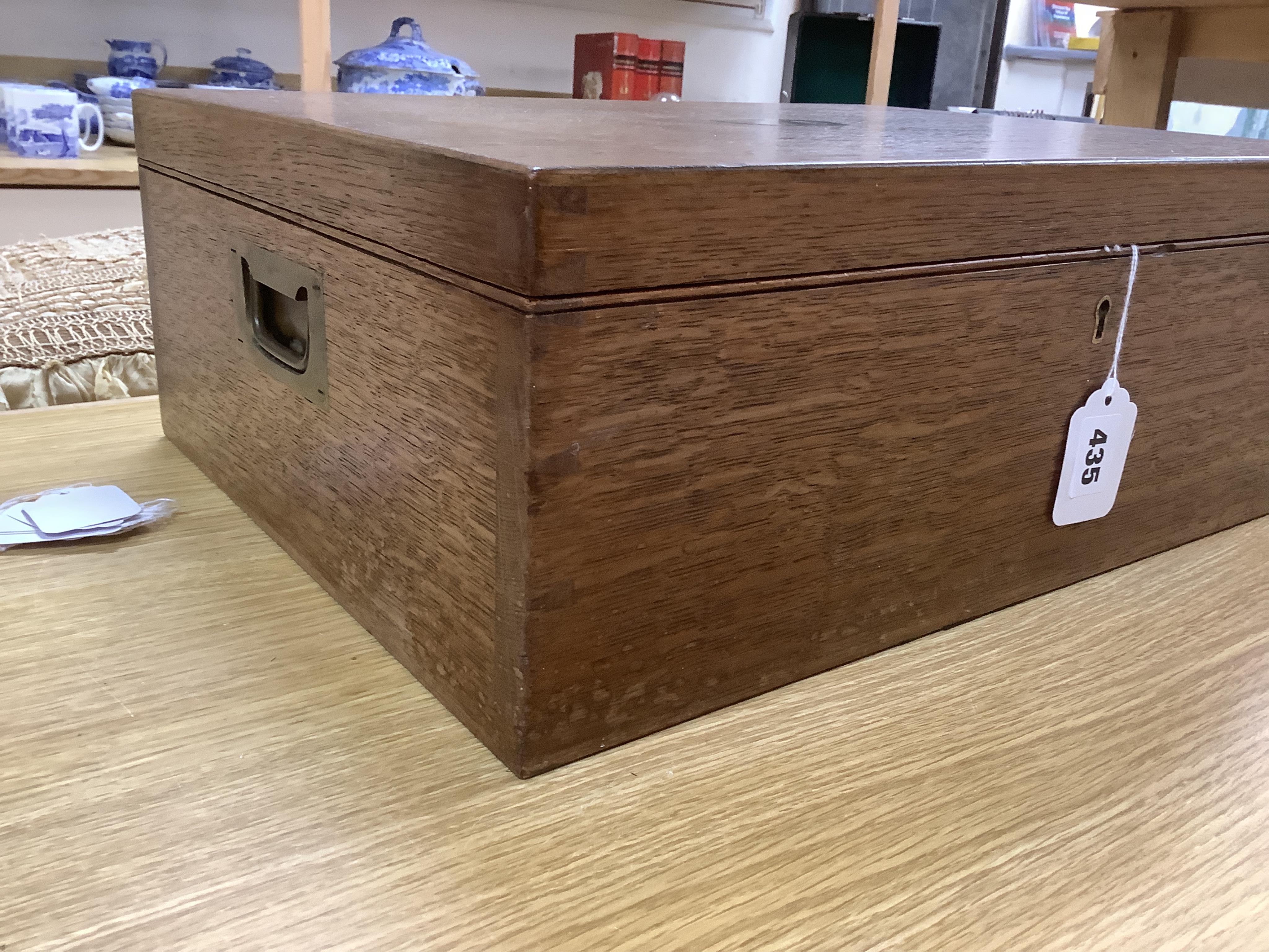 An Elkington & Co plated Old English pattern canteen of cutlery, oak cased, 48cm wide. Condition - fair